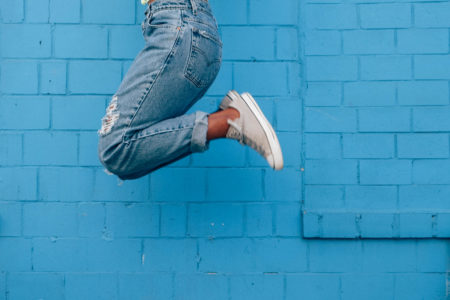 10 habits of healthy, happy women - woman jumping 