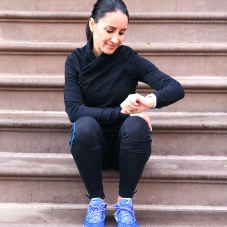 Health Coach Marissa Vicario | You don't have to sweat to get a good workout | fit woman looking at fitness tracker